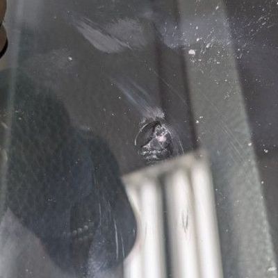 A small chip in a windscreen, before the repair