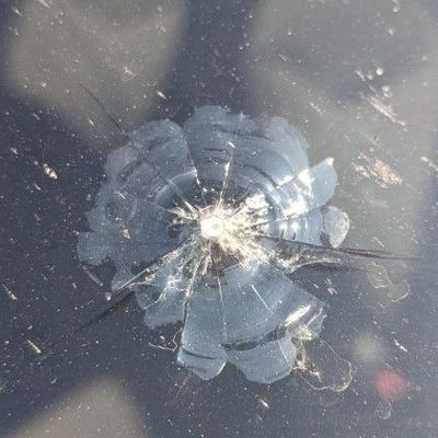 A star chip in a windscreen, before the repair