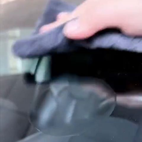 Wiping a windscreen clean at the end of a chip repair